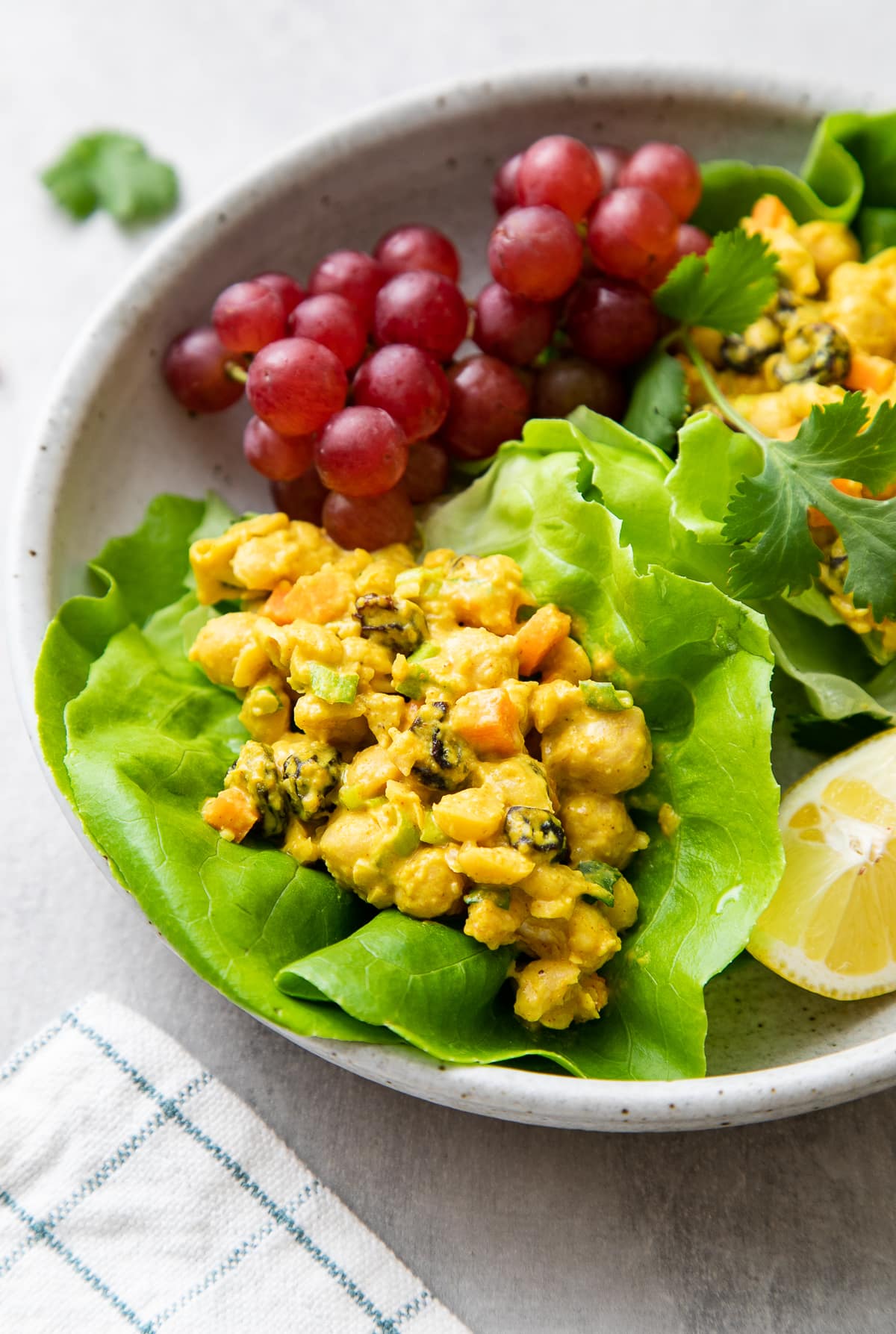 side angle view of fresh lettuce wraps with curried chickpea salad.