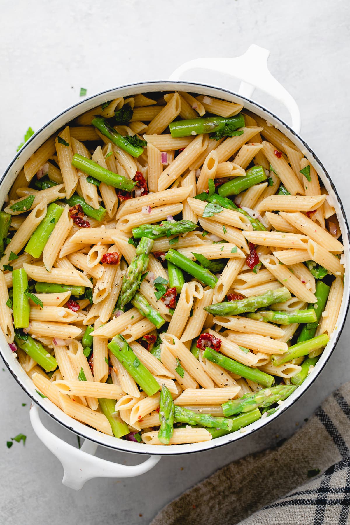 top down view of freshly made lemon asparagus pasta in a pot.