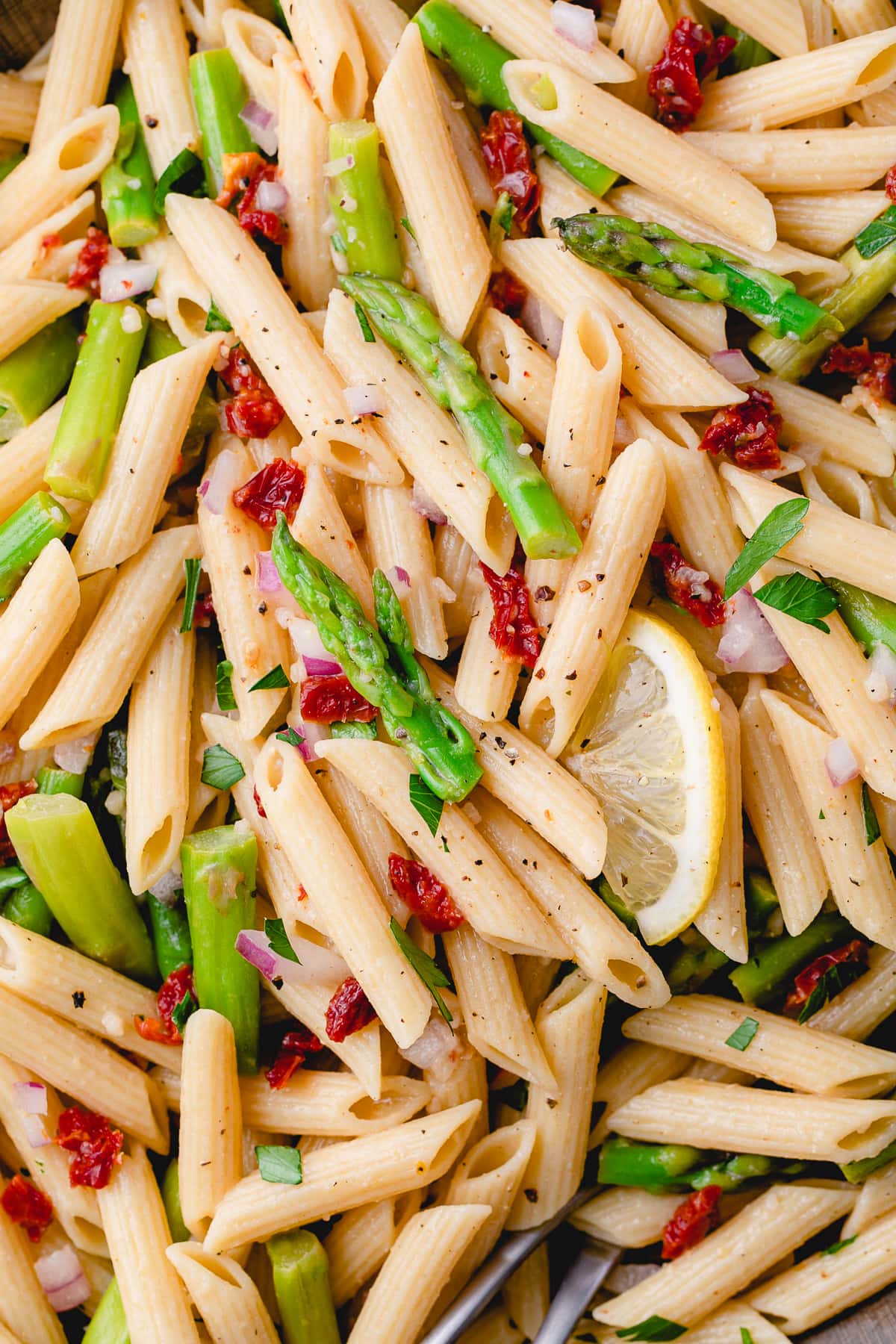 top down view of garlic lemon asparagus pasta salad.