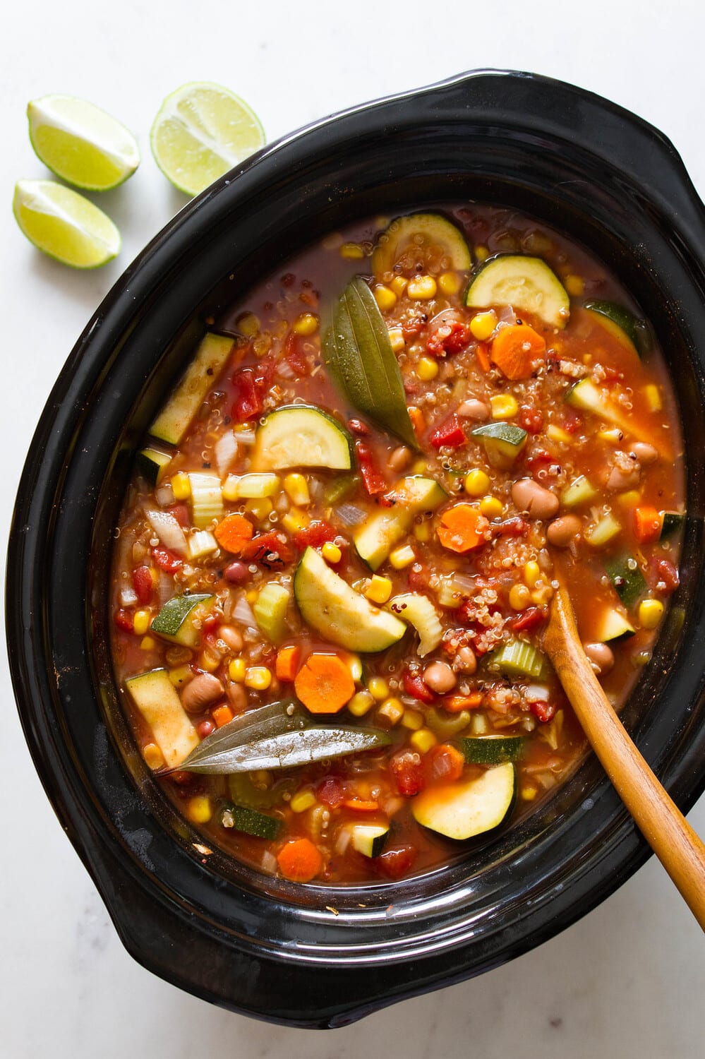 top down view of crockpot with freshly cooked tex mex quinoa vegetable soup.