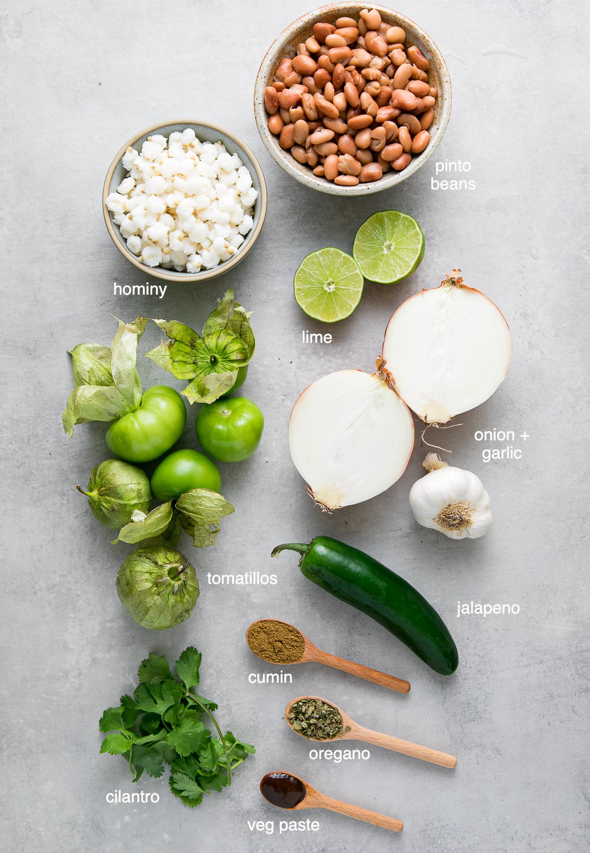 top down view of ingredients used to make posole verde with pinto beans and tomatillos.
